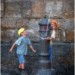 Due bambini e una fontana