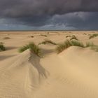 Dünen und Regenwolken