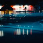 E. Haas - June 1968 Cars outside an entrance way seen through a windscreen at nightime.