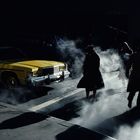 E. Haas - Pedestrians crossing a New York street in winter time cast long shadows, 1980.