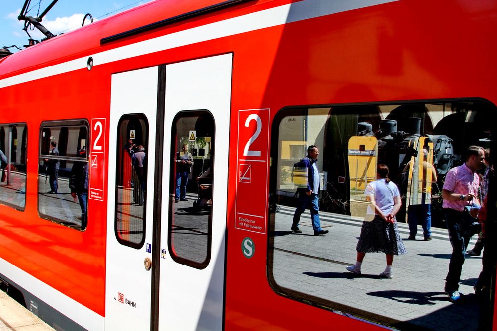 Reisende im Spiegel de HG-Foto