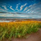 Ebbe und Sonnenuntergang am Evangeline Beach, Nova Scotia Kanada