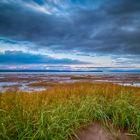 Ebbe und Sonnenuntergang am Evangeline Beach, Nova Scotia Kanada