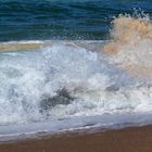 Eclatement de vague sur la plage