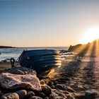 Ein Fischerboot bei Sonnenuntergang