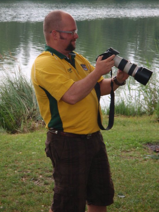 Ein Hintergrundbild, der Fotograph bei der Arbeit