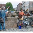 Ein Straßenmusikant und der Fotograf