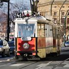 Eine historische  Straßenbahn.