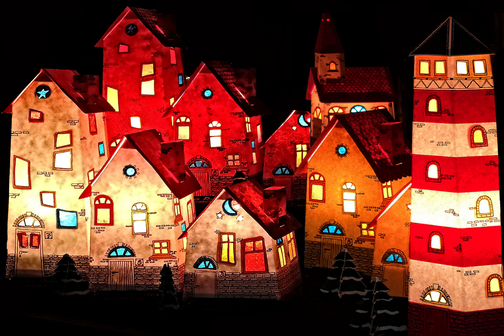 Eine weihnachtlich leuchtende Stadt aus Papier