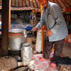 Elderly host producing Kumis