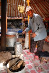 Elderly host producing Kumis