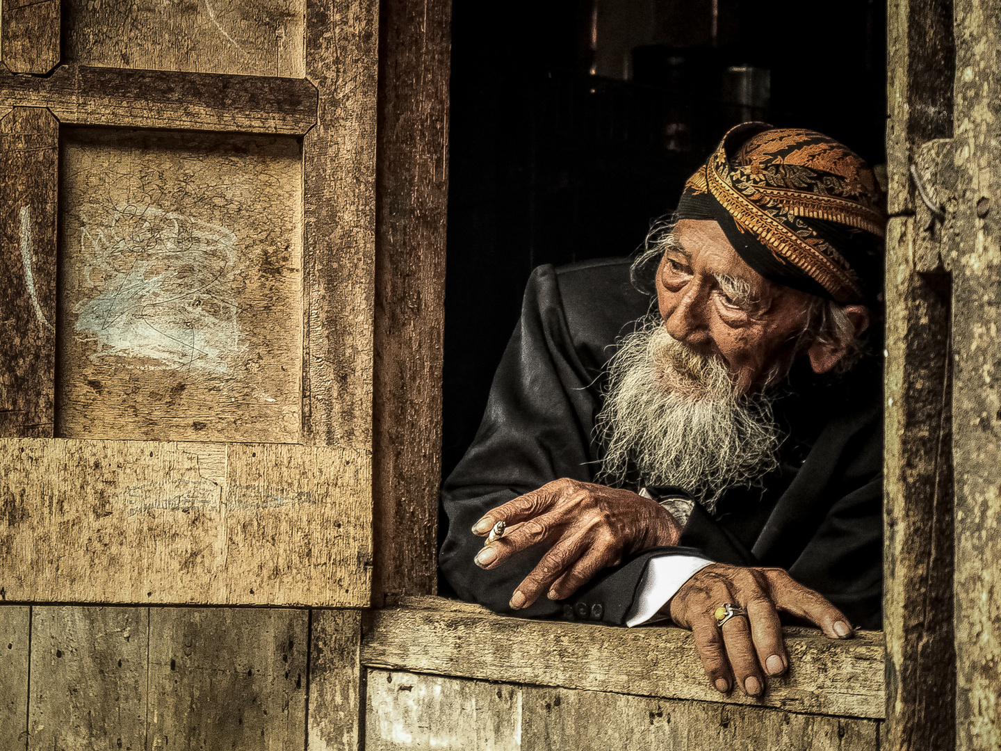 enjoying a cigarette at the window