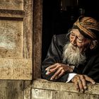 enjoying a cigarette at the window