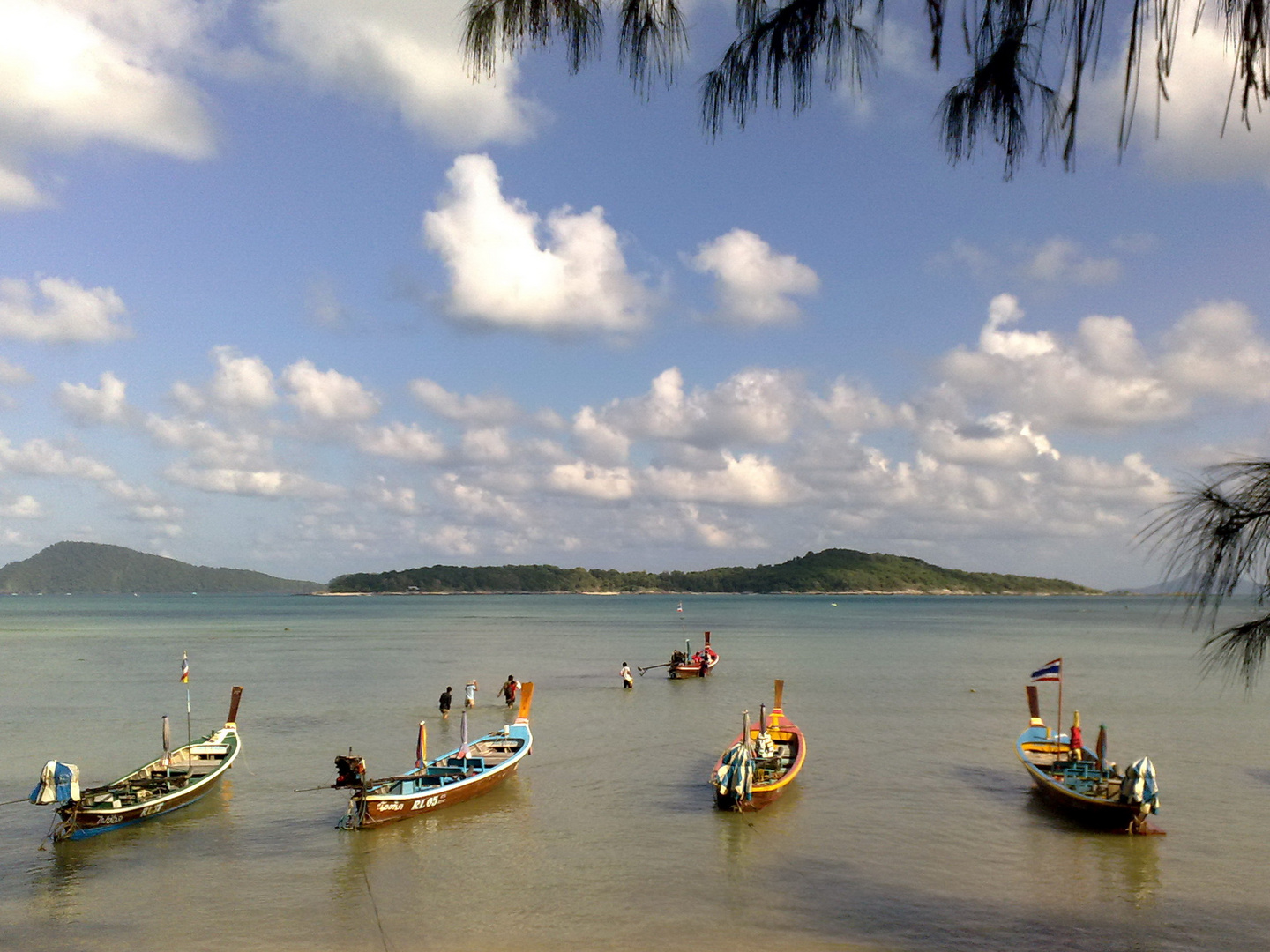 Evening view of Bon Island from Rawai Beach, Phuket, Thailand.