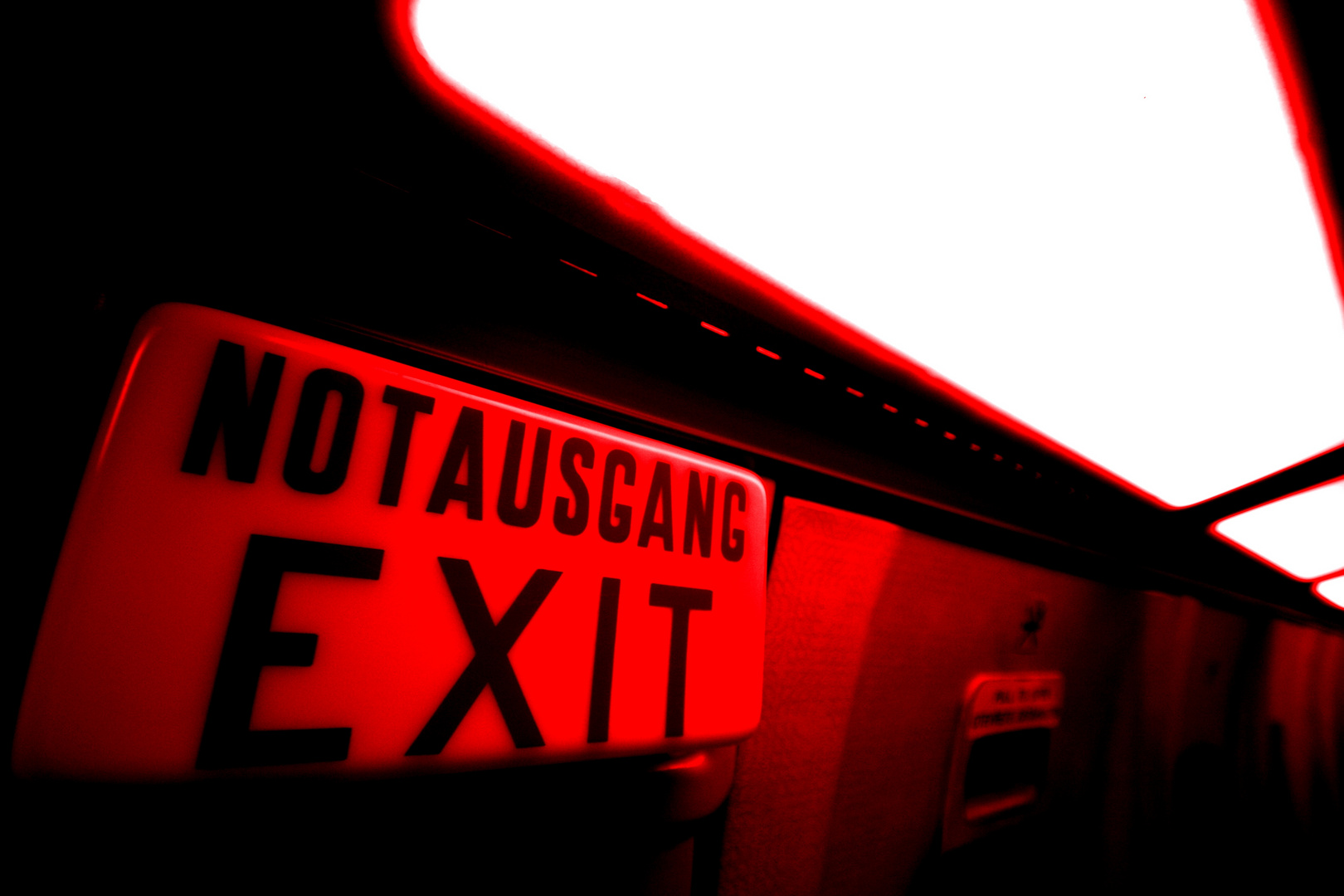 EXIT to the left in the direction of light