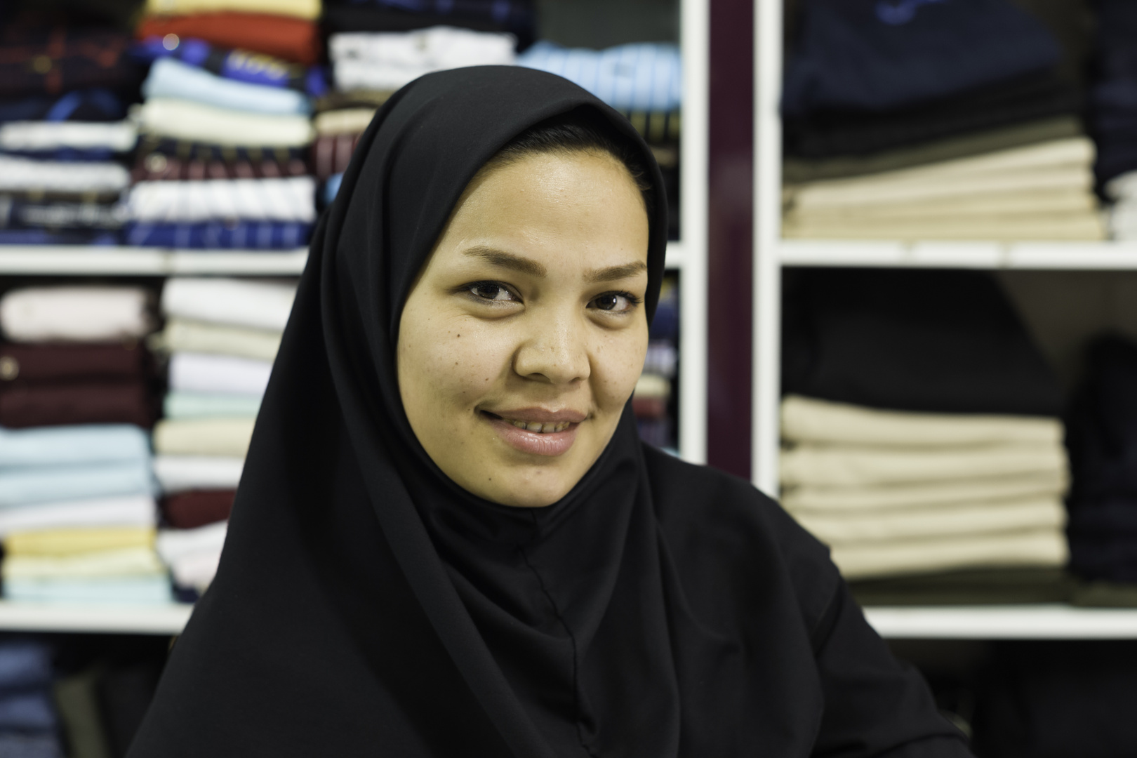 Faces of Iran - Afghan saleswoman in a clothing store