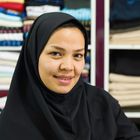 Faces of Iran - Afghan saleswoman in a clothing store