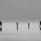 Familie am weiten Strand