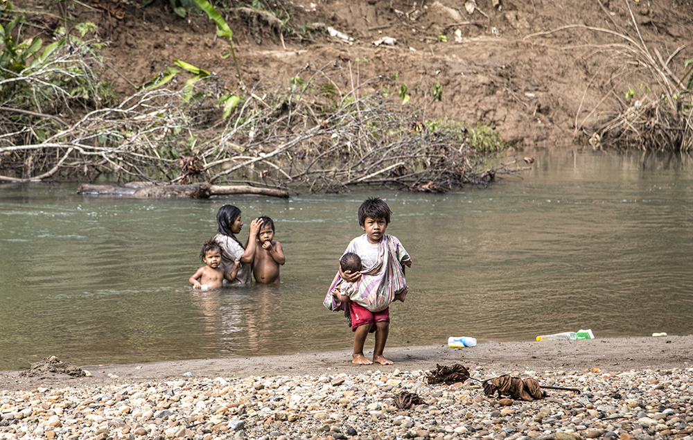 Family bathing in Amazon