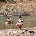 Family bathing in Amazon