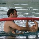 Father and son playing in swimming-pool.