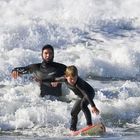 Father and son surf lesson in Morro Bay, CA.