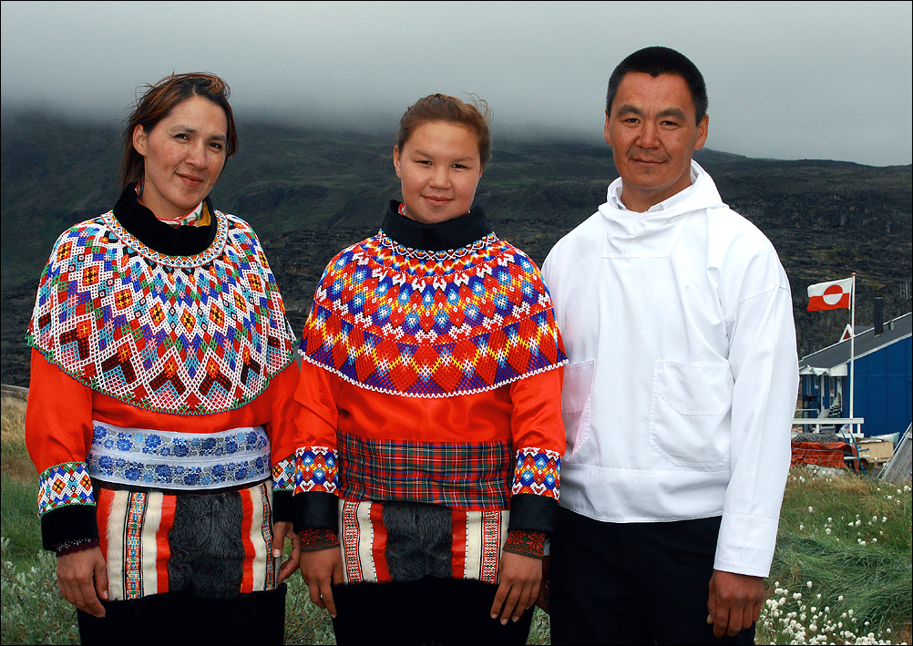 Father, mother and daughter in National costumes for the celebration of confirmation. Greenland.