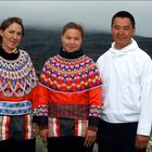 Father, mother and daughter in National costumes for the celebration of confirmation. Greenland.