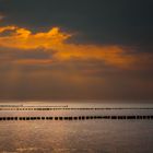 Fehmarn- Pfahlsitzen zum Sonnenuntergang