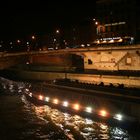 Ferry Under Paris Bridge