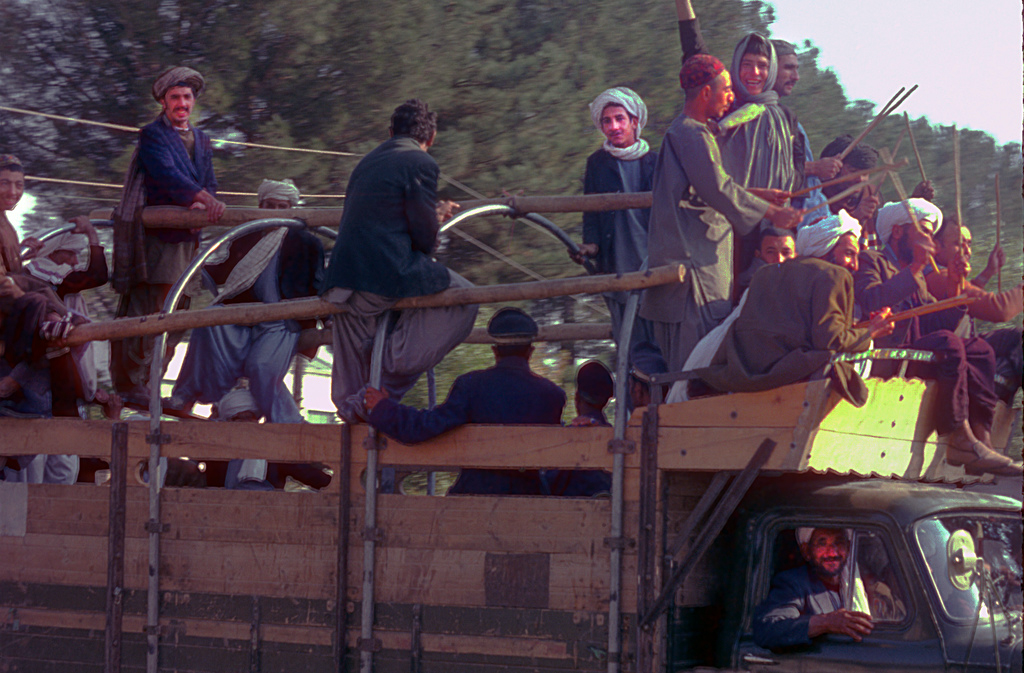 Field workers return to their homes