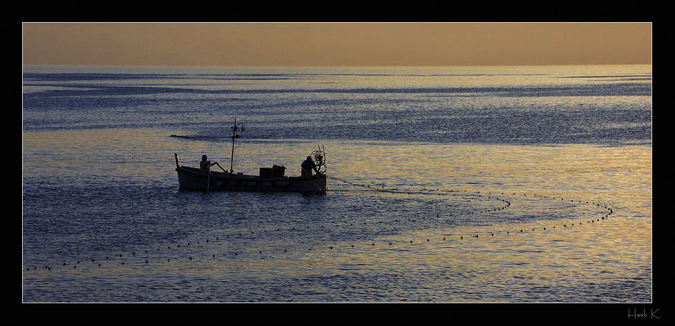 Fischen bei Sonnenuntergang