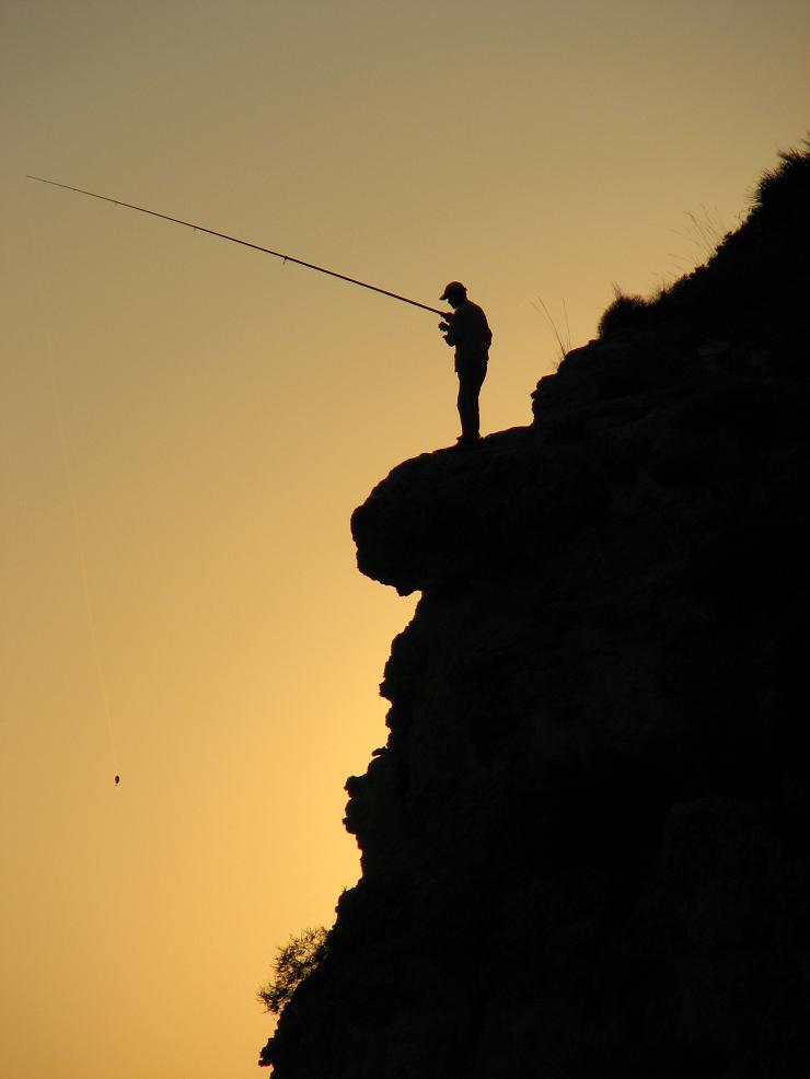 Fischer im Abendlicht