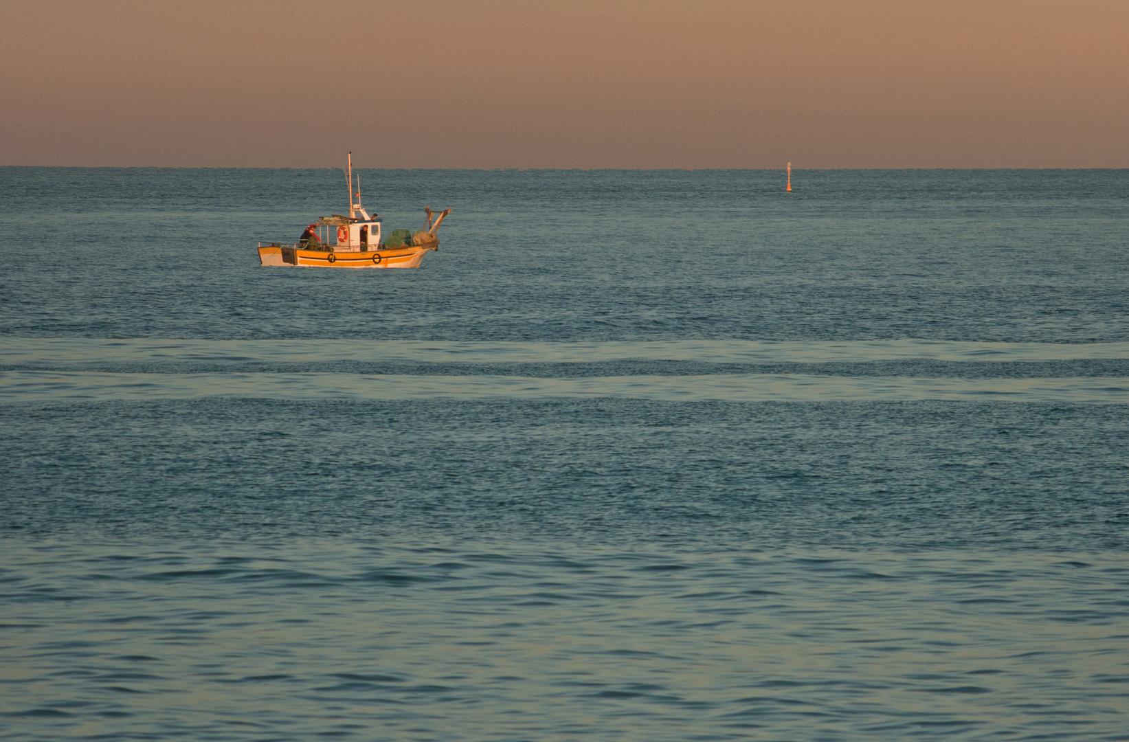 Fischer im Abendlicht