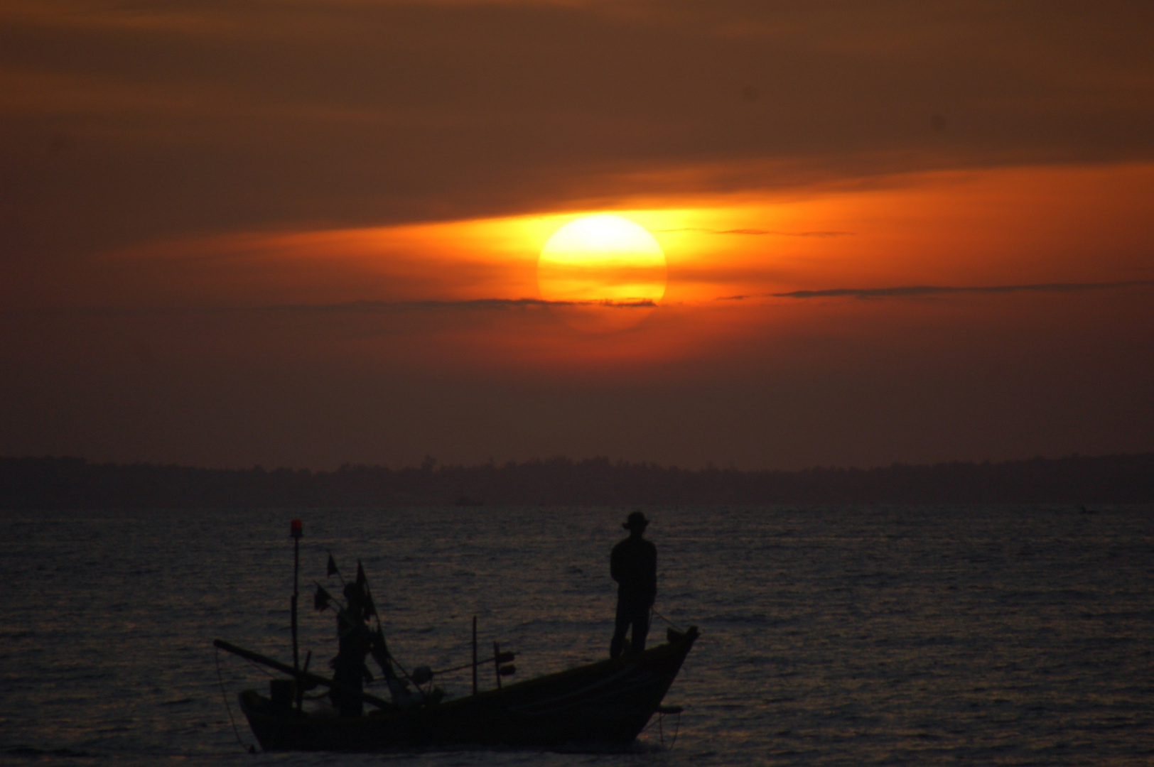 Fischer im Sonnenaufgang