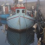 Fischerboot am Nebelmorgen