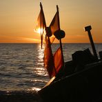 Fischerboot im Sonnenaufgang