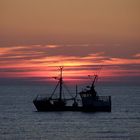 Fischerboot im Sonnenuntergang