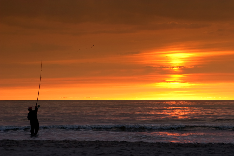 Fisher in the sunset