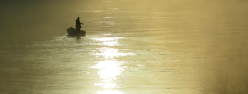 Fisherman and Fog in the morning sun