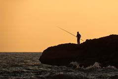 Fisherman at sunset