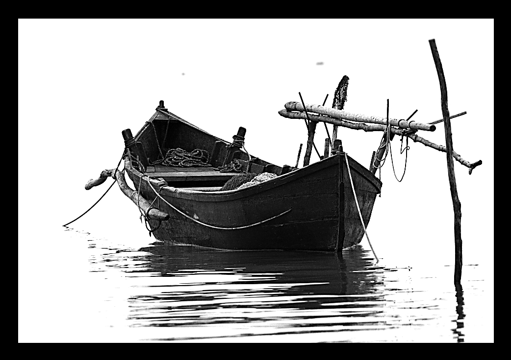 fisherman boat on razelm lake - danube delta, romania