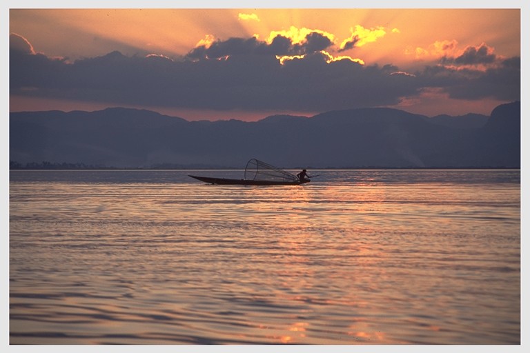 Fisherman on Inle Lake at sunset