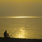 Fishing at dawn on Olympus beach