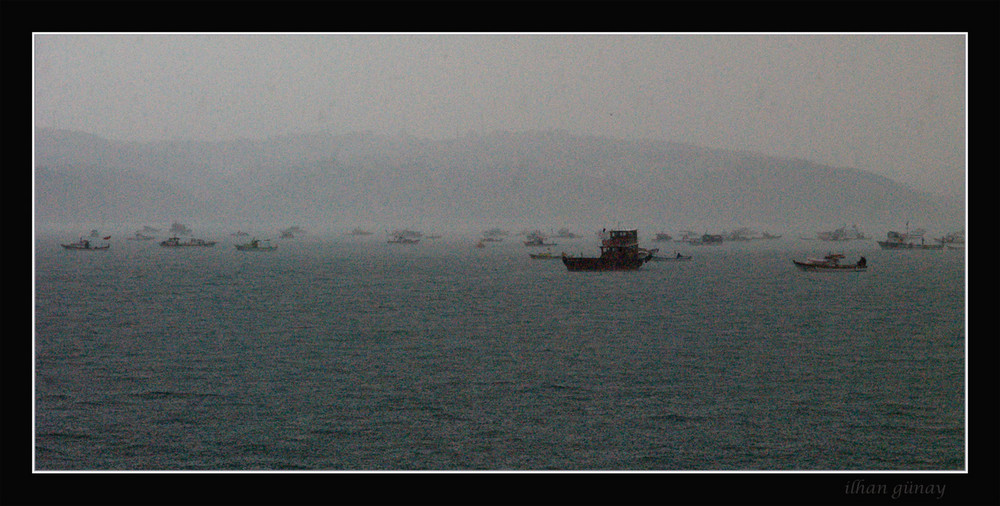 fishing boats in a rainy day