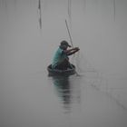 Fishing in morning mist