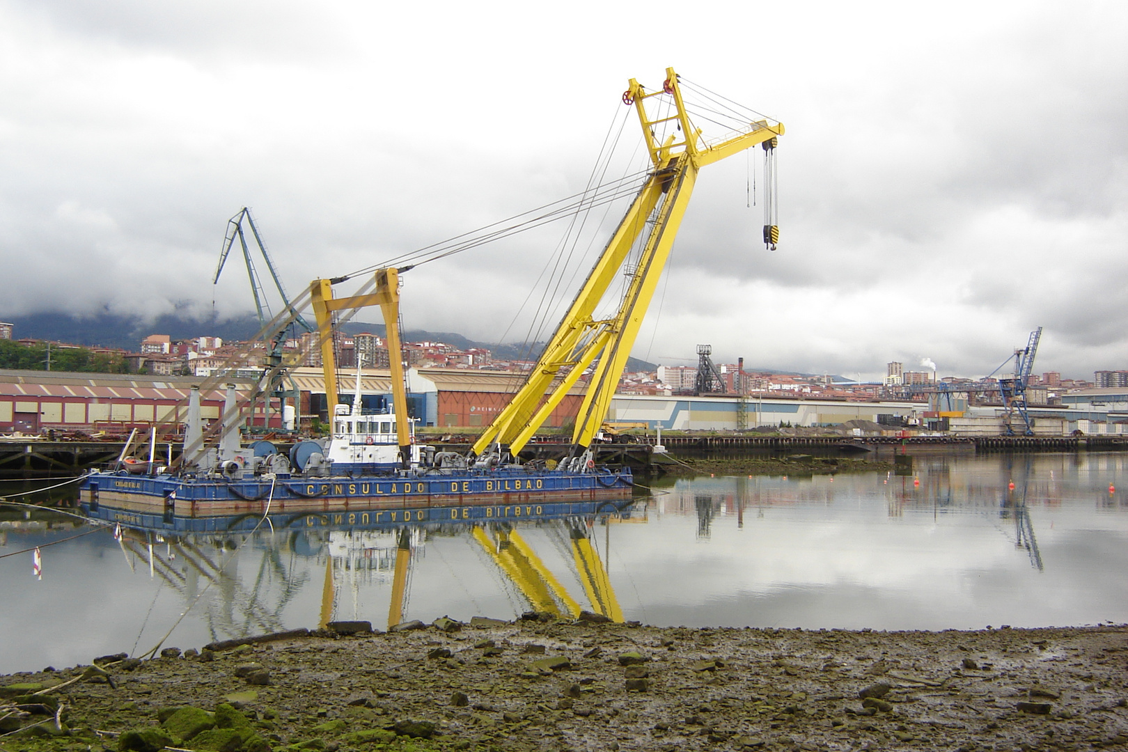 Floating crane moored at Bilbao docks. Northern Spain.