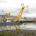 Floating crane moored at Bilbao docks. Northern Spain.