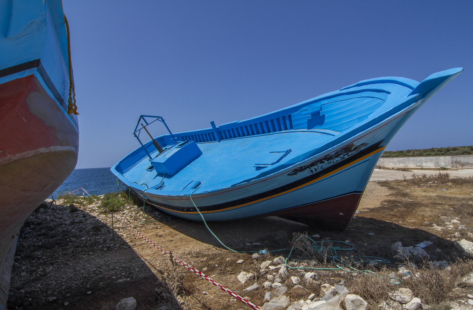 Flüchtlingsboote am Hafen von Portopalo di Capopassero