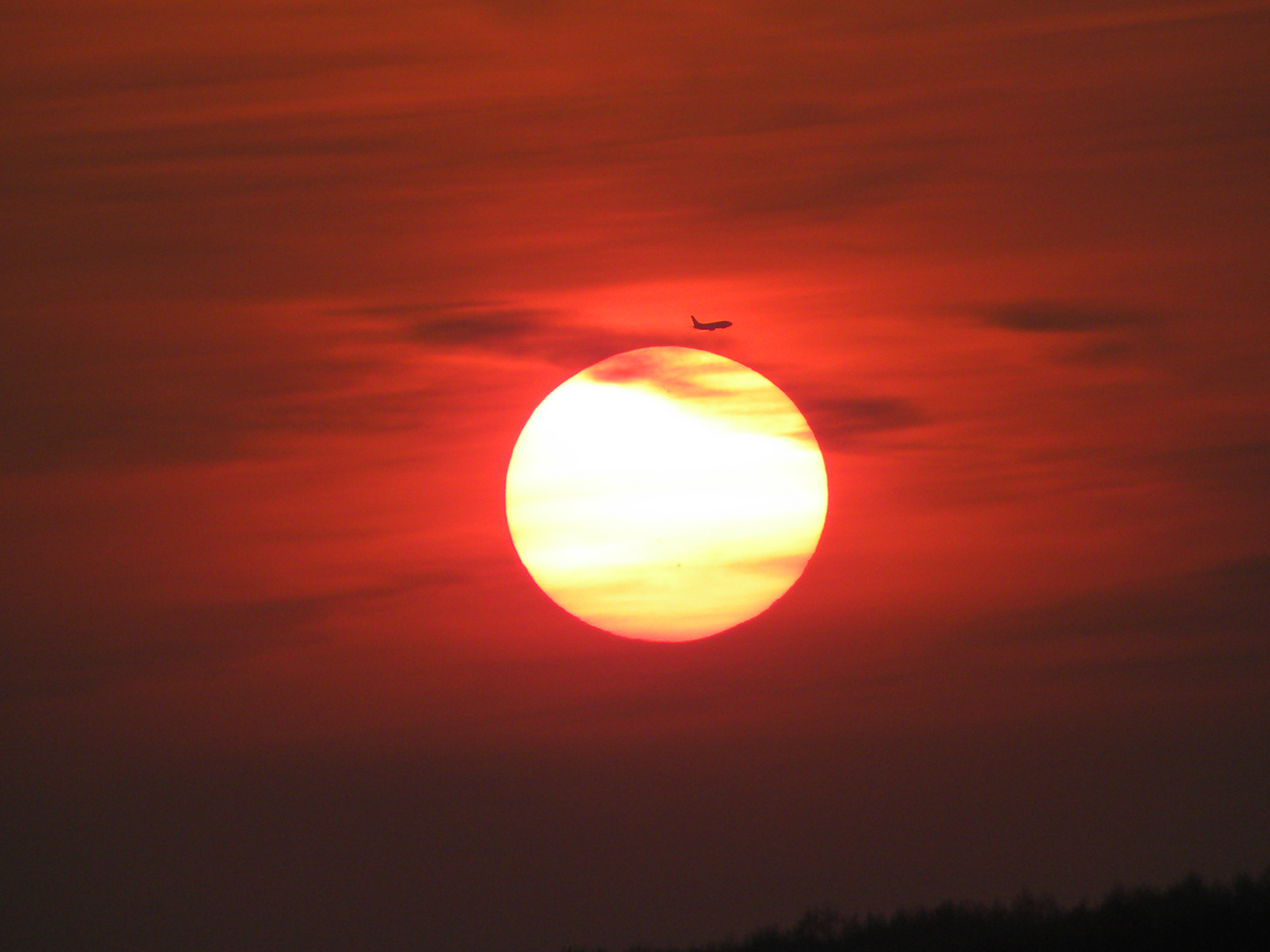 Flug in den Sonnenuntergang